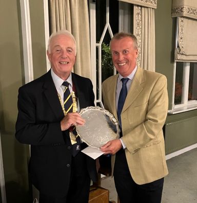 Ex President Phil Loader receives Cyril Last Trophy from Robert, winning the competition with an impressive 42points   