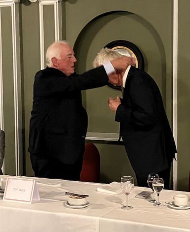 Rob Laceby the new President receives  the Chain of Office from Robert hands 